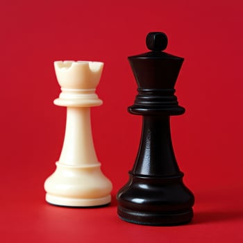 Chess pieces on a vibrant red background display photo