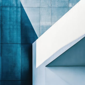 A blue wall with a white wall behind it photo