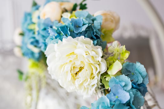 Closeup of artificial flowers blue-yellow-green colors photo