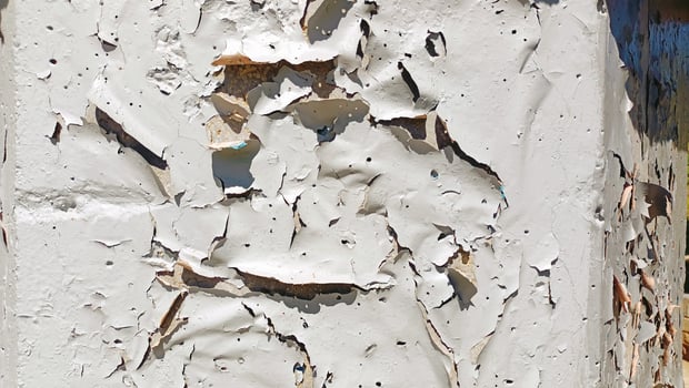 Detailed CloseUp of Peeling White Paint on a Wall Capturing the Unique Texture and Aesthetic photo