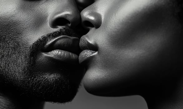Closeup portrait of couple kissing. Black and white photo, closeup photo