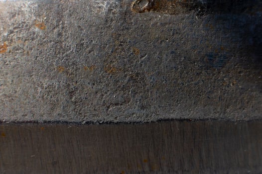 Rusty metal texture for background. Macro shot of stainless steel knife opening with rust photo