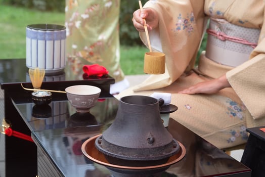 Woman in kimono performs Japanese tea ceremony.Japanese culture photo