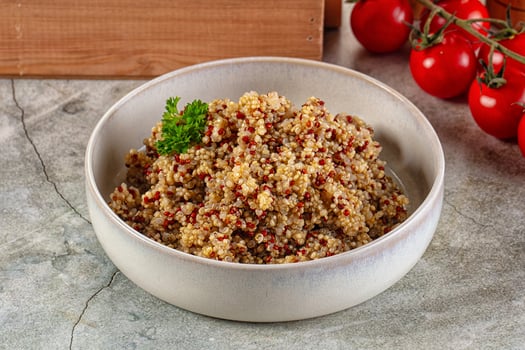 A bowl of quinoa with herbs and tomatoes photo