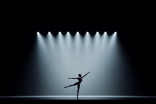 Silhouette of a ballerina in a spotlight photo