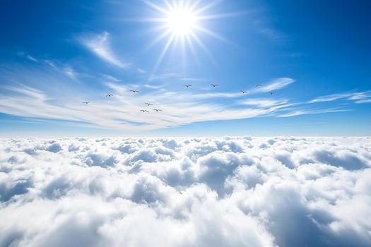 A view of the sun shining over the clouds photo