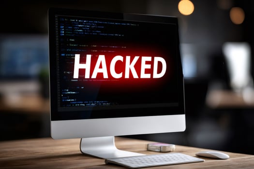 Computer monitor showing hacked message during cyberattack in office photo