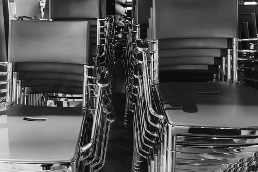 Metal chairs arranged neatly in a modern indoor space showcasing contemporary design and sleek architecture photo
