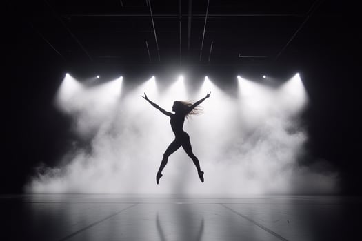 A woman in a black dress is jumping in the air photo