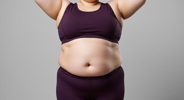A woman in a purple sports bra top and pants photo