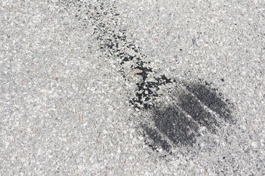 Tire Marks on an Asphalt Surface Showcasing Automotive Artistry and Landscape Details photo