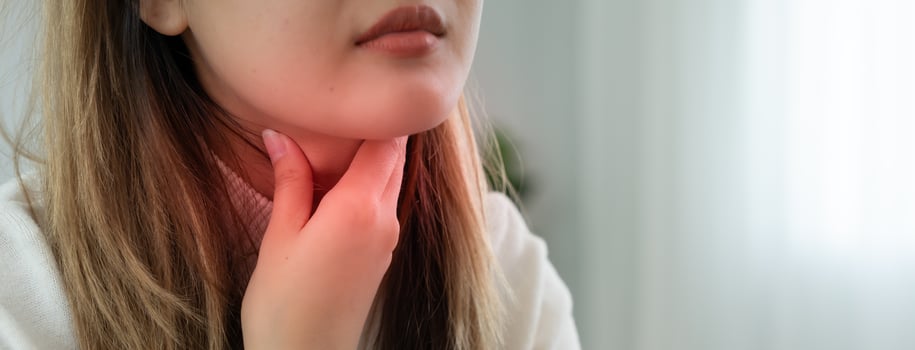 Asian woman sore throat. female tonsillitis causes a inflammation. treated by taking water, taking antibiotics, consult a doctor, virus, corona virus, Influenza, flu photo