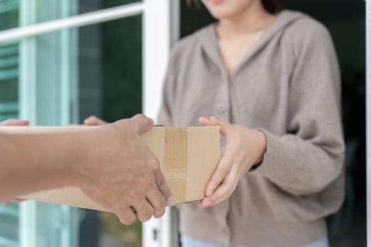 receives boxes parcel from courier in front house. Delivery man send deliver express. online shopping, paper containers, takeaway, postman, delivery service, packages photo