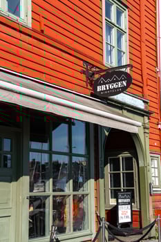 Bergen, Norway - July 9, 2024. Sign of Bryggen Nightclub on traditional wooden facade. photo