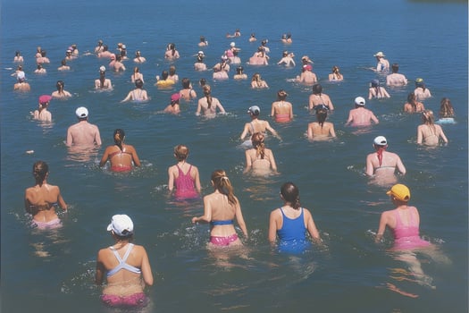 A large group of people swimming in the water photo