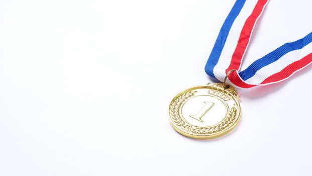 Gold demonstration trophy medals with ribbon photo
