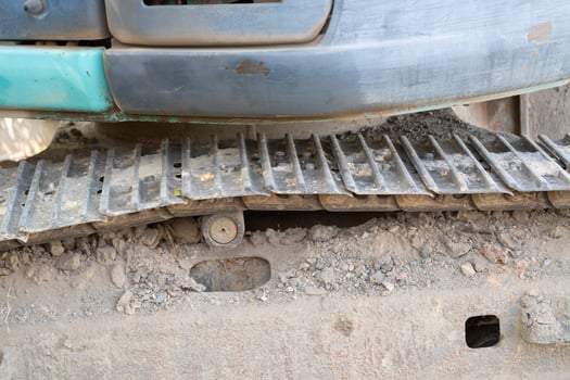 Excavator operation construction site machinery urban environment close-up view heavy machinery maintenance photo
