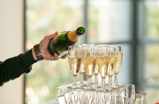 The waiters pouring champagne at a wedding photo