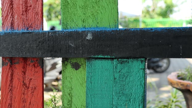 Old multicolored wooden fence. colorful natural background. photo