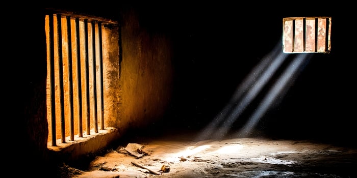 Dark Prison Cell Sunlight Through Bars Hope Freedom photo