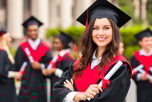 Positive pretty young lady student having graduation party, wearing graduation costume and holding diploma, happy female graduate proudly posing at university campus, blurred background photo