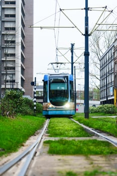 Discover the modern urban landscape of Rotterdam with its electric trams, a sustainable and convenient public transit system that enhances the city's mobility. photo