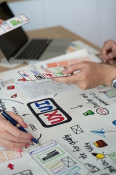 Collaborative UX UI Design Session. Team members sharing design ideas. photo