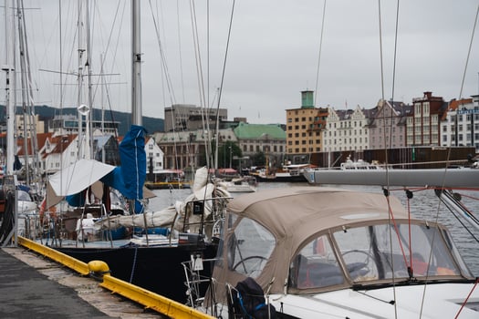Bergen, Norway - July 10, 2024. Yachts and sailboats moored along the harbor photo
