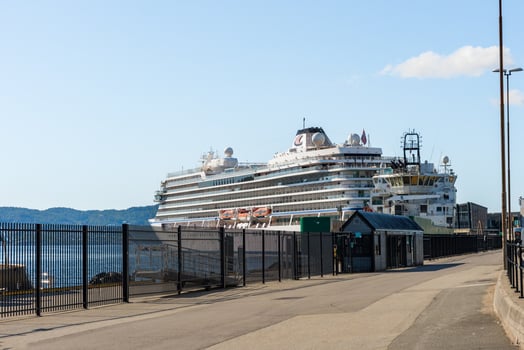 Bergen, Norway - July 9, 2024. Viking Venus cruise ship docked in port terminal with clear sky photo