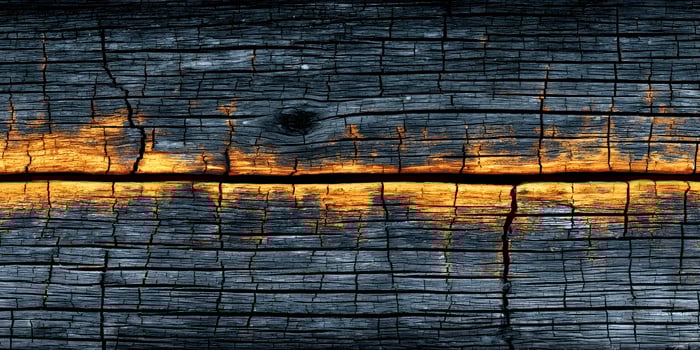 Dark Gray Weathered Wood Texture with Orange Accents Cracked Wooden Surface Background Old Rustic Timber Detailed Grain photo