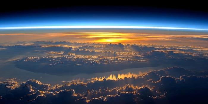 Golden Hour Sunset Above Earth Cloudscape Aerial View photo