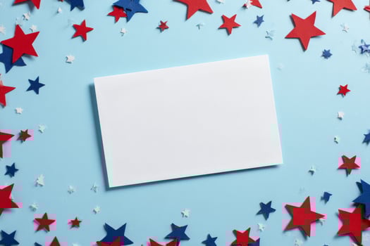 Brightly Colored Stars Surround a Blank Card on a Blue Background for Creative Projects and Celebrations. photo