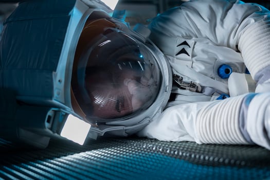 Astronaut losing life in accident onboard space station after sudden system failure during routine operations. Man lies motionless on spaceship floor, facing urgent medical emergency crisis photo
