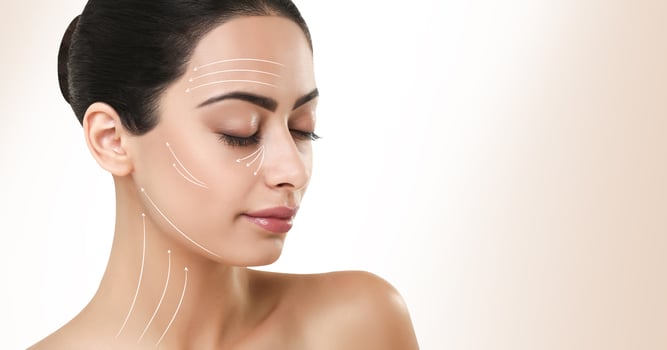 Woman with massage lines on perfect face, copy space photo