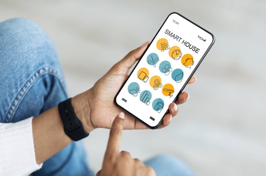 Cellphone with Smart home app in unrecognizable black lady hands, creative image for modern technologies and household. African american woman using smart house software on mobile phone, cropped photo