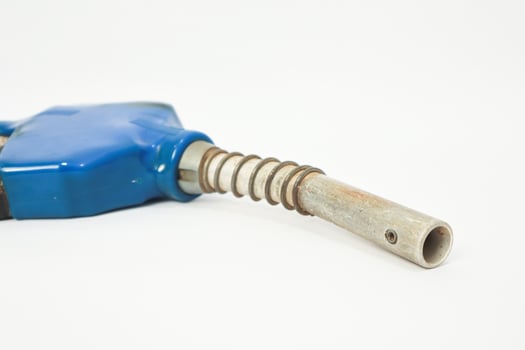 Isolated fuel nozzle on white background highlighting transport sector reliance photo