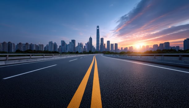 Asphalt road with city skyline photo