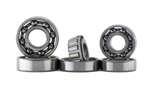 Set of ball bearings standing and laying isolated on white background photo