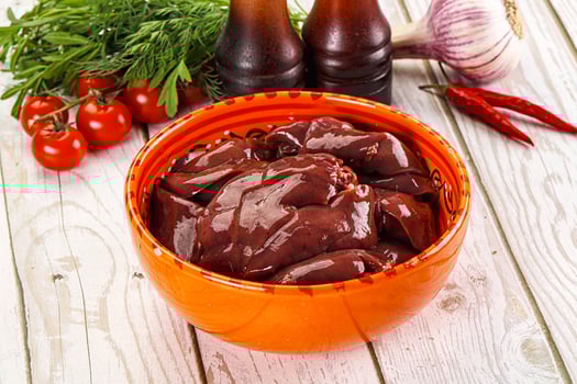 A bowl of brown sauce on a table photo