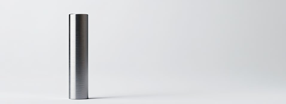 A vertical metallic cylinder stands on a white background photo