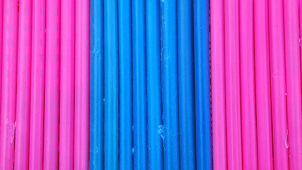 Colorful plastic straws as background, close-up shot. photo