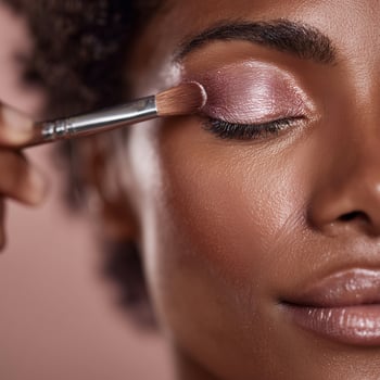 Woman applies makeup. portrait. photo
