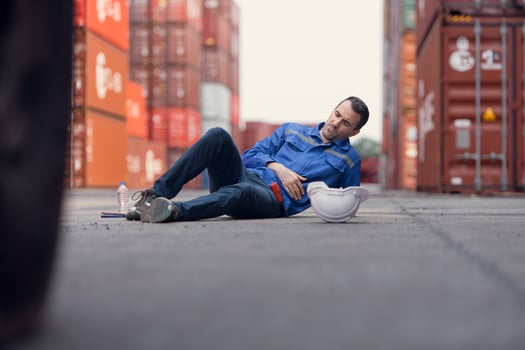 A worker in a container warehouse fainted while working in the bright sunlight and hot weather of a container storage yard,150 photo