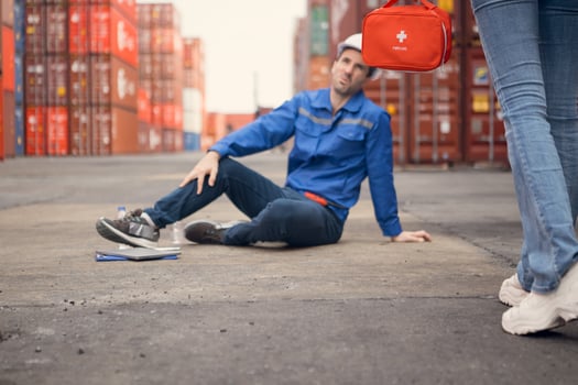 First aid for a container warehouse worker fainted while working in the bright sunlight and hot weather of a container storage yard,112 photo