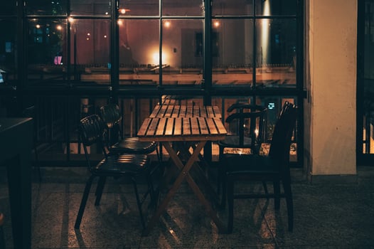 Pub bar with window, warmth light and wooden table and chair photo