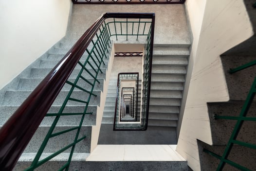 Top view of square shaped vintage staircase endless pattern on building photo
