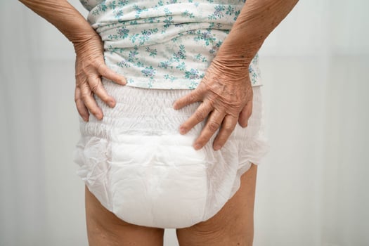 woman patient wearing adult incontinence diaper pad photo