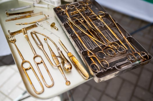 A table with various gold tools on it photo