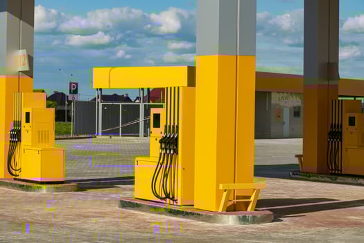 Car gas station at sunset. Yellow modern gas station photo