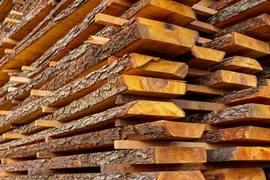 A boards in an industrial sawmill. Wood timber construction material photo
